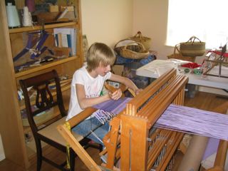 Girl weaving on Baby Wolf loom
